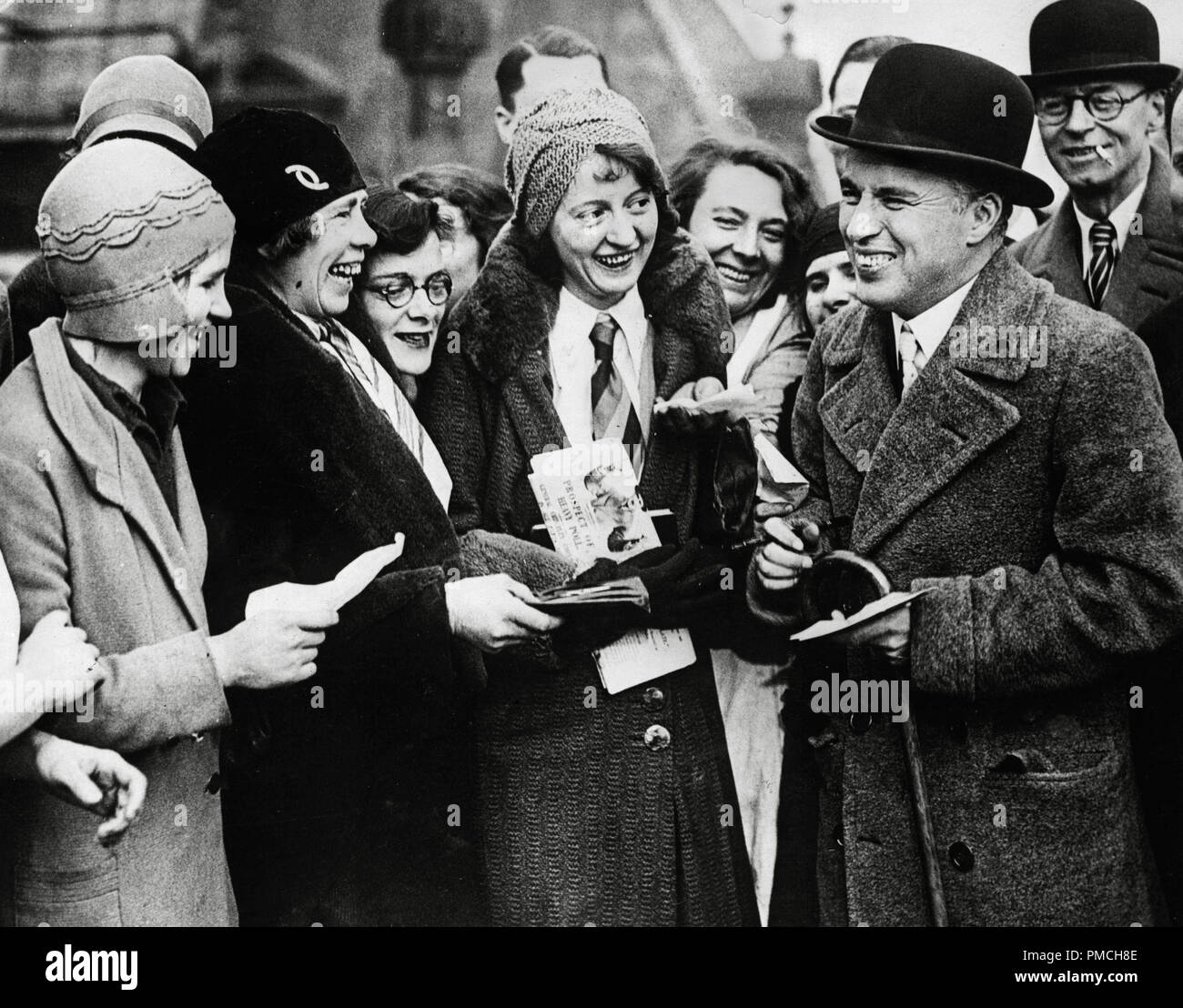 Charles Chaplin, signs autographs for fans circa 1931 File Reference ...