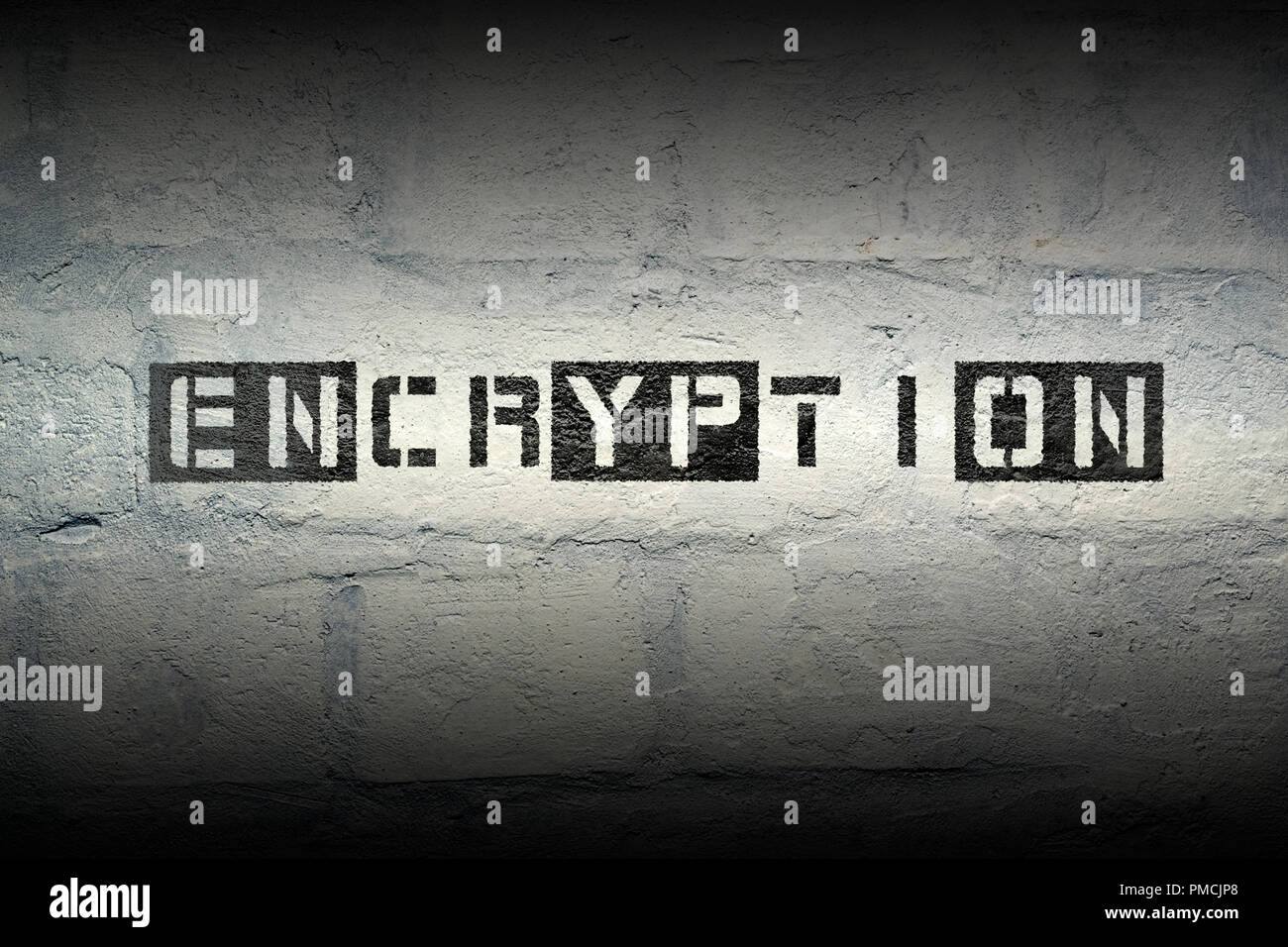 encryption stencil print on the grunge white brick wall Stock Photo