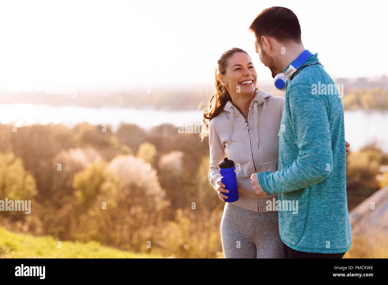 Happy young sporty couple sharing romantic moments Stock Photo - Alamy