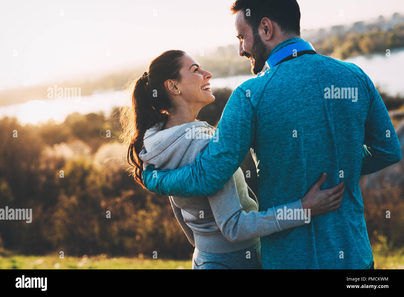 Happy young sporty couple sharing romantic moments Stock Photo - Alamy