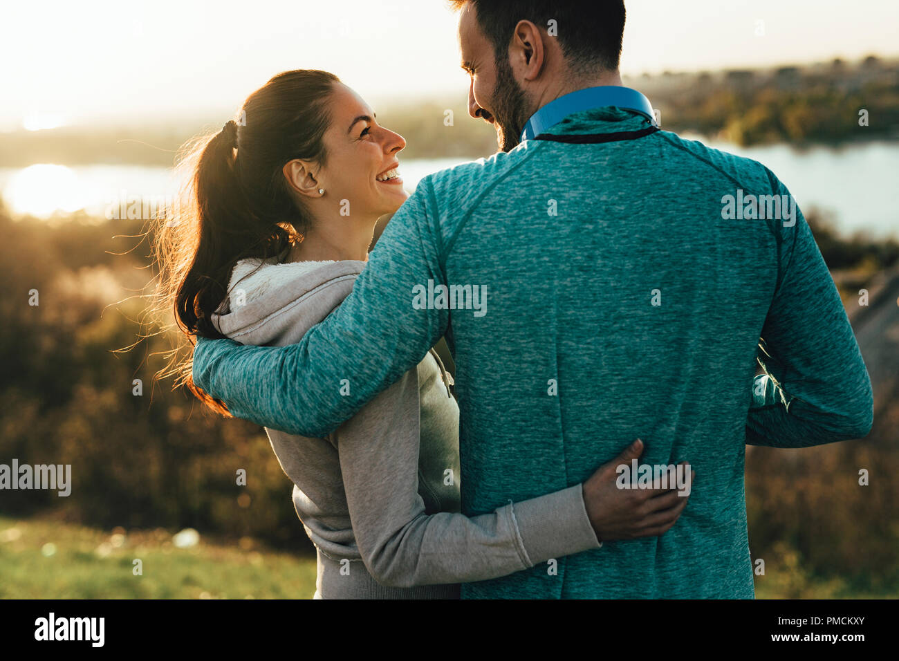 Happy young sporty couple sharing romantic moments Stock Photo - Alamy