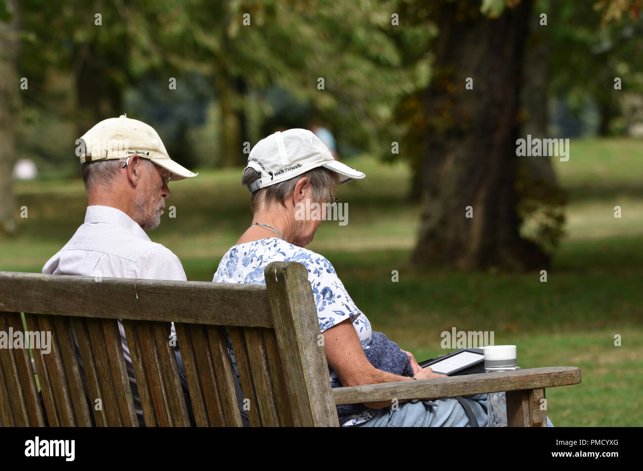 Over sixty elderly couple in the park Stock Photo