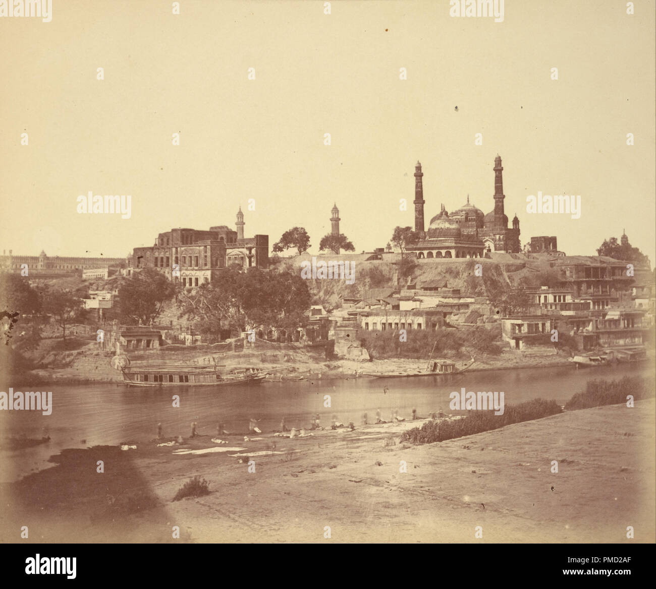 [The Muchee Bhawan Fort and the Gomti River Taken from the Stone Bridge]. Date/Period: 1858. Print. Albumen silver. Height: 245 mm (9.64 in); Width: 294 mm (11.57 in). Author: Felice Beato. Stock Photo