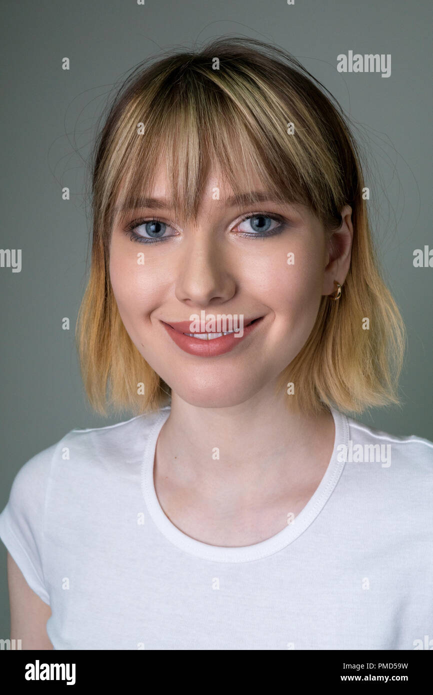Portrait Of A Beautiful Girl With Short Blond Hair Stock Photo