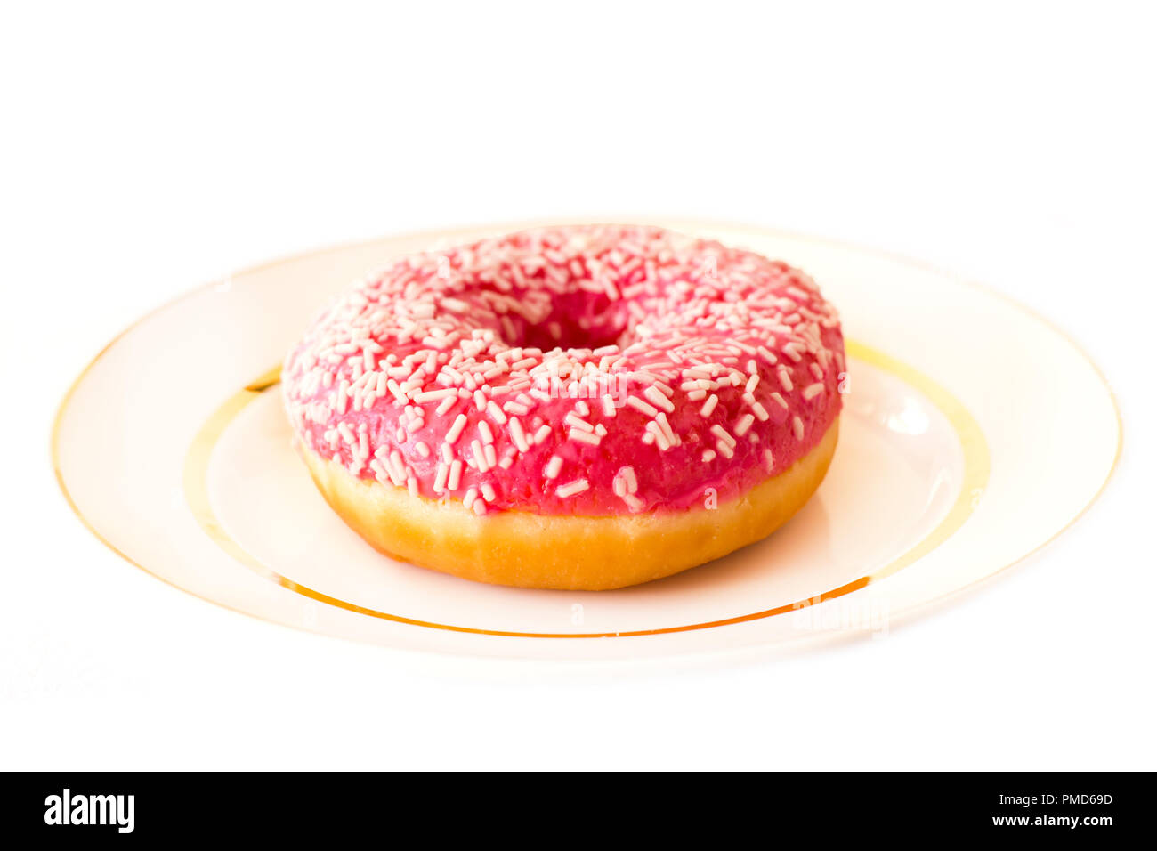 Brightly pink donut on white background Stock Photo