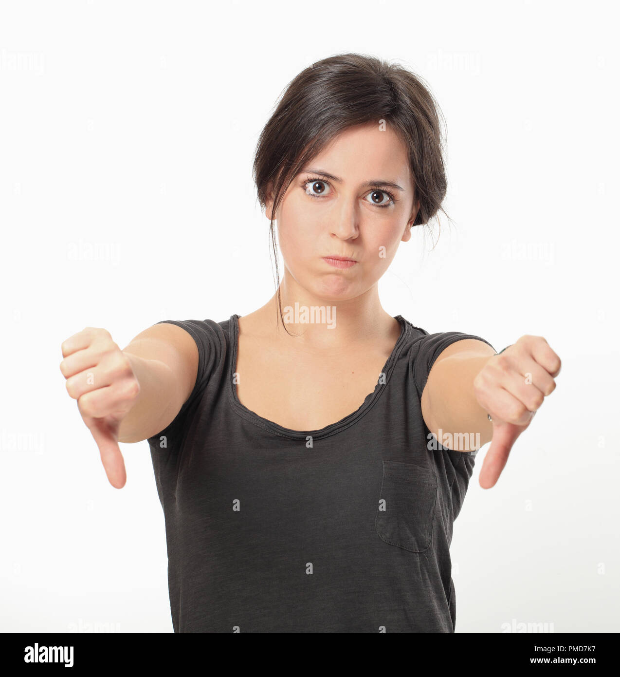 Young angry woman thumbs down Stock Photo