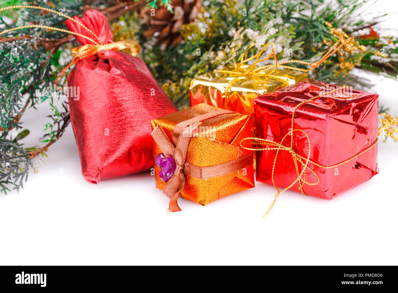 Christmas boxes and fir tree branches on white background Stock Photo
