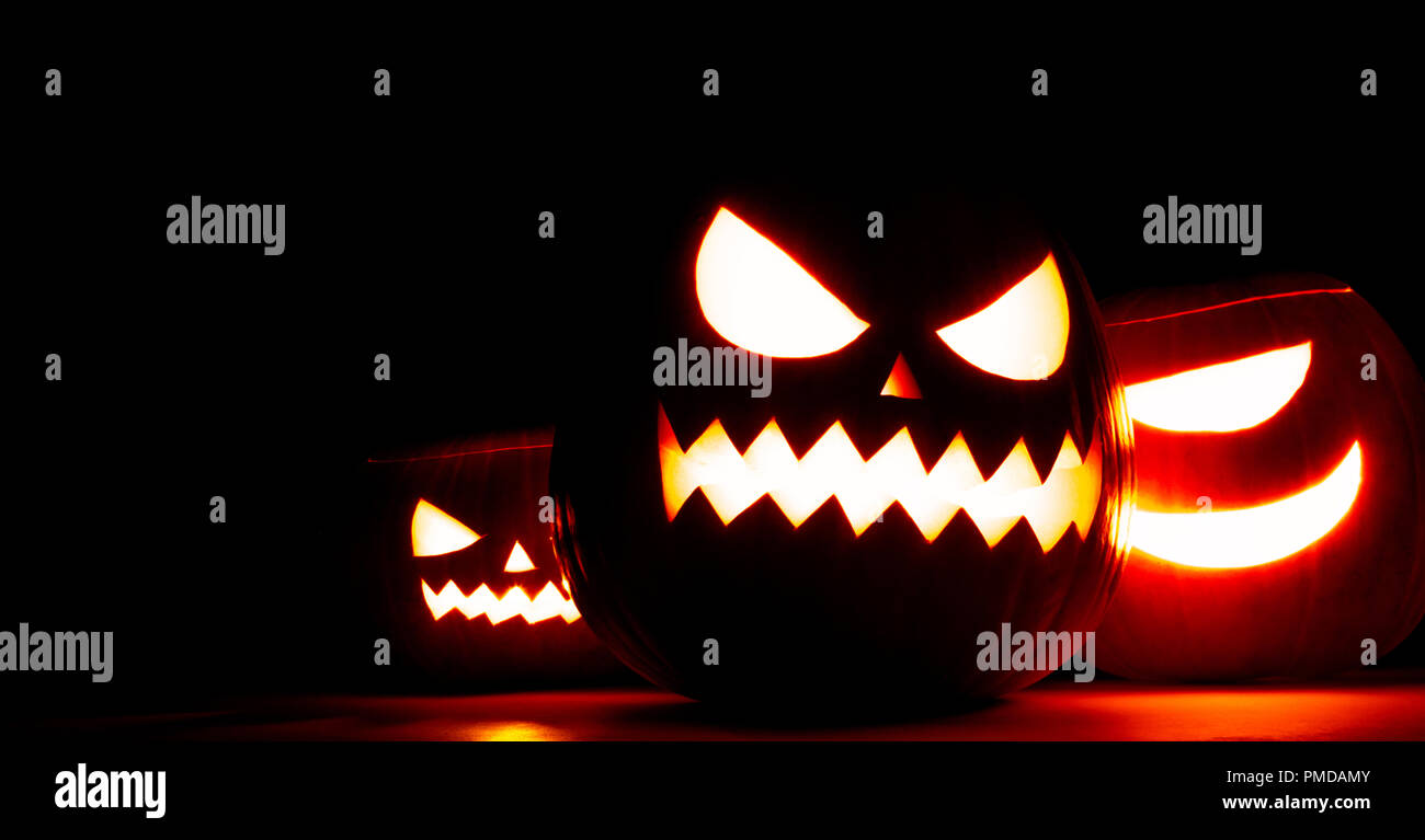 Group of Halloween pumpkin heads jack o lantern in darkness Stock Photo ...