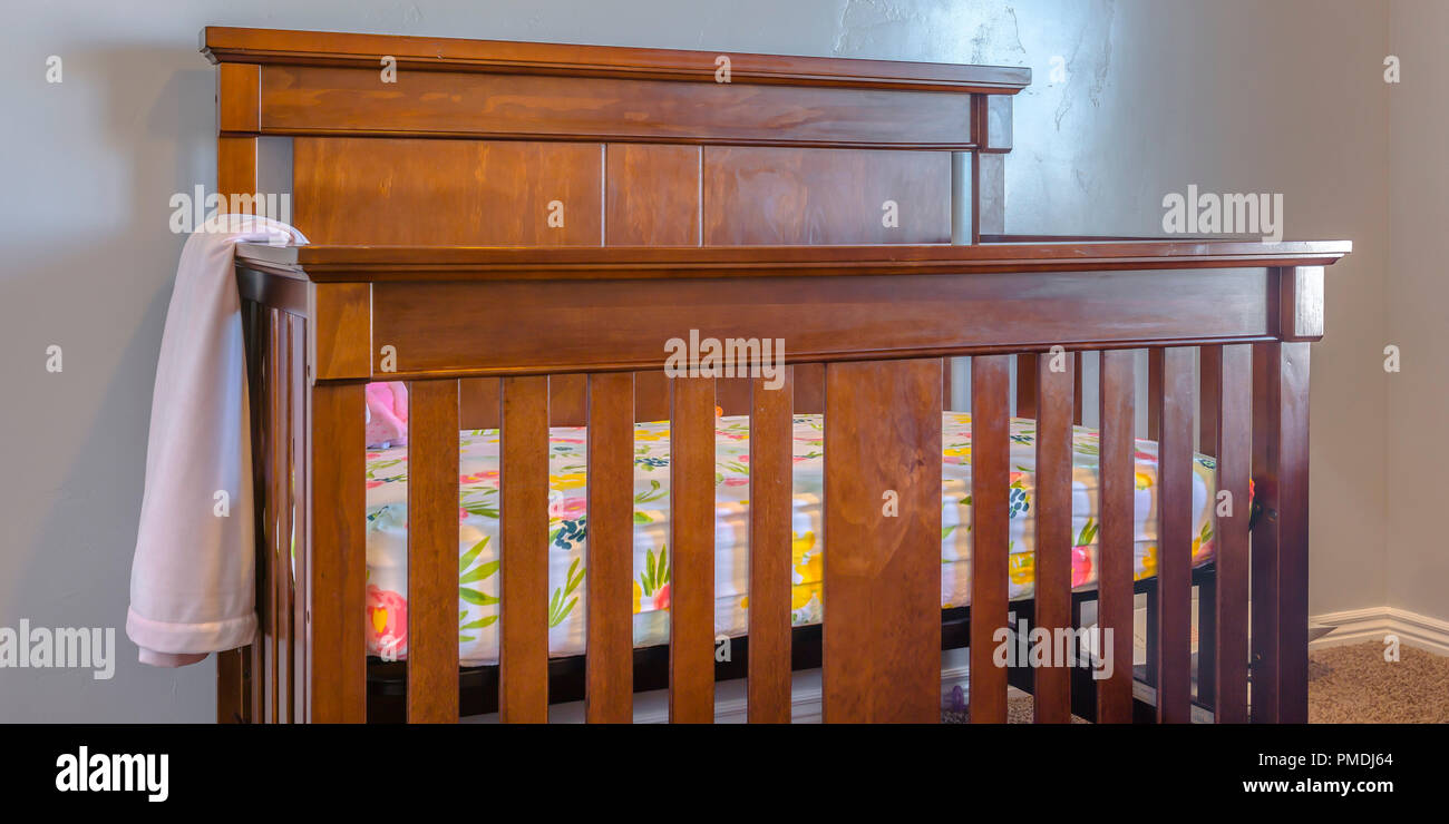 Varnished wooden crib inside a nursery Stock Photo Alamy