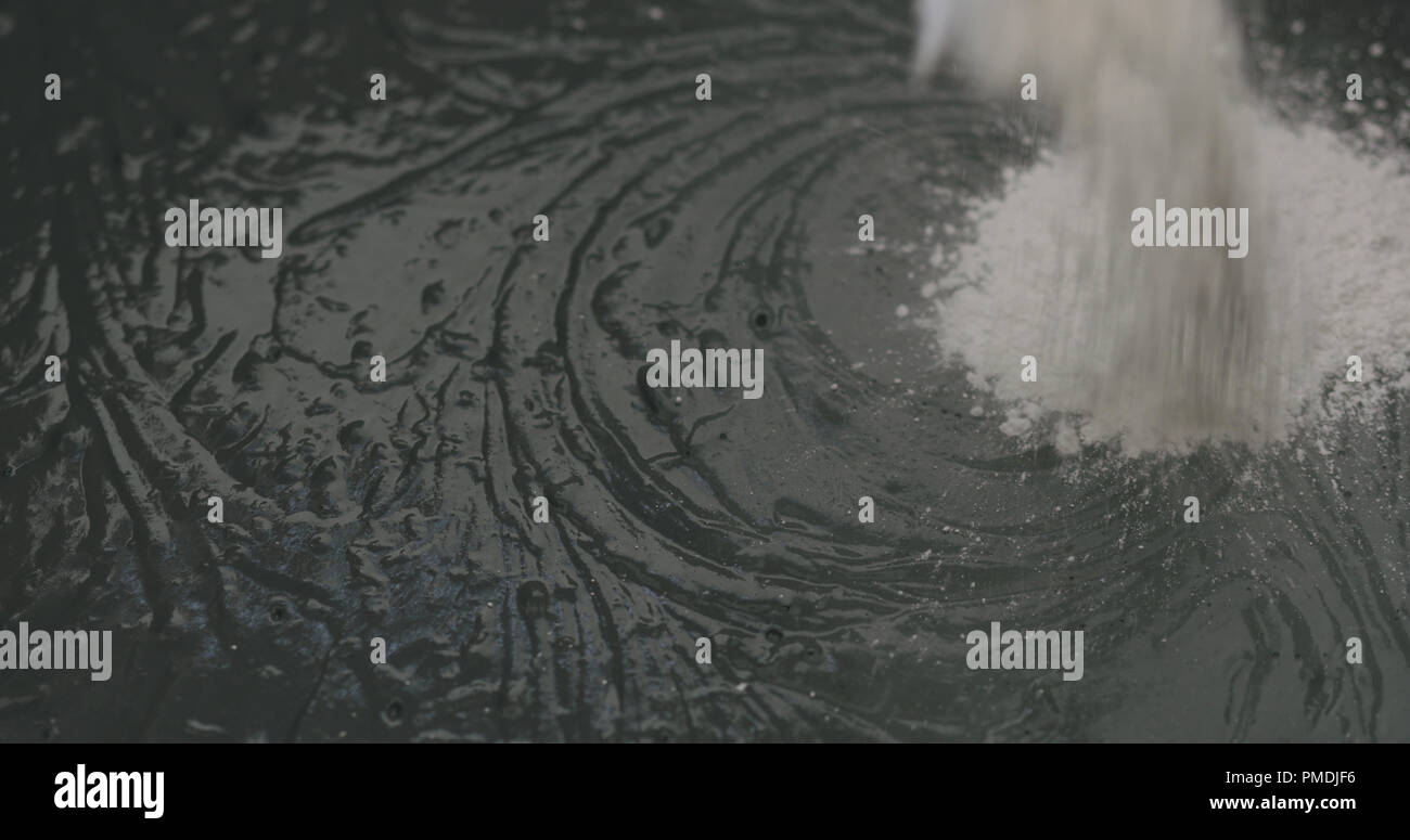 adding hardener to micro concrete plaster Stock Photo Alamy