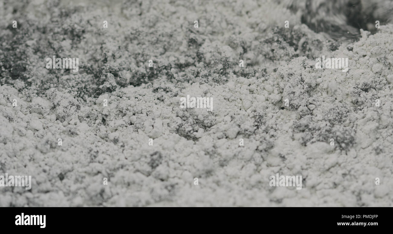 mixing hardener in micro concrete plaster Stock Photo Alamy