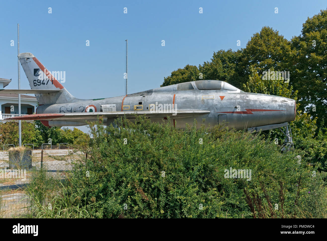 dismissed jet fighter abandoned in a field, Italy Stock Photo