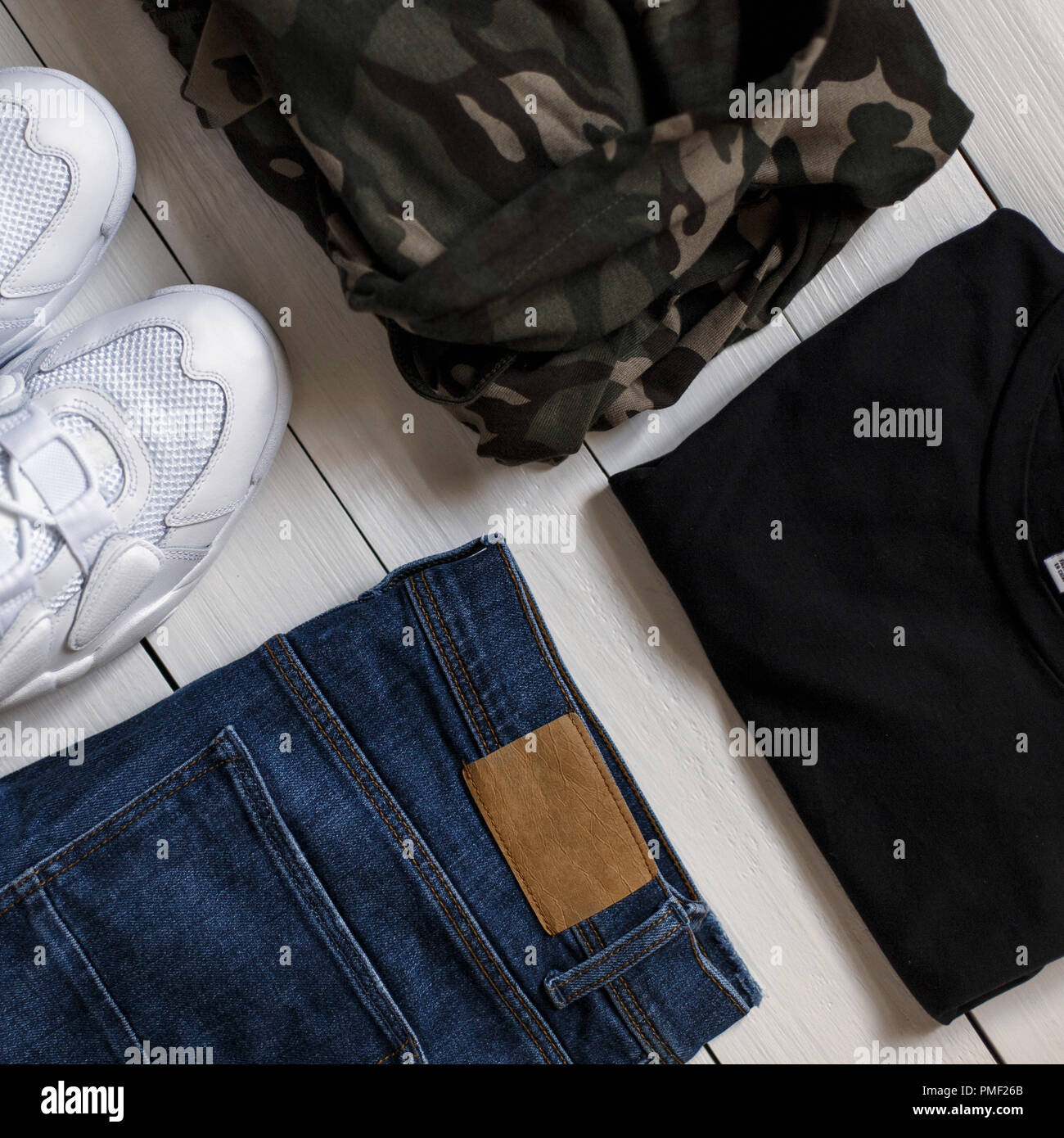 Stylish Fashion Collection Of Men S Summer Clothes On A White Background White Sneakers With Blue Jeans A Military Shirt And A Black T Shirt On A Wo Stock Photo Alamy Stylish Fashion Collection Of Men S Summer Clothes On A White Background White Sneakers With Blue Jeans A Military Shirt And A Black T Shirt On A Wo Stock Photo Alamy