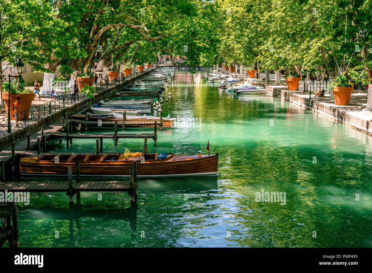 Wood boat and canal view taken from bridge of loves in Annecy France Stock Photo
