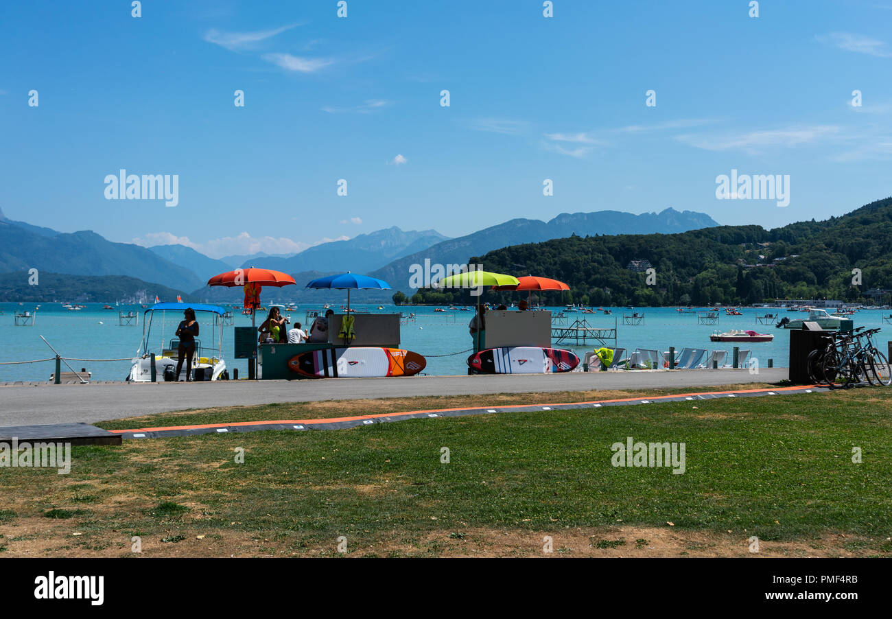 7 August 2018, Annecy France : renting stand for paddleboards and pedalos and Annecy lake view in France Stock Photo