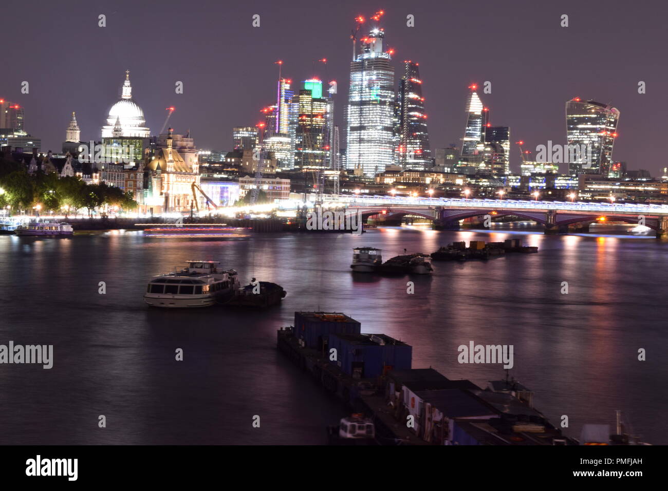 London South Bank by night using long exposures to create light trails Stock Photo