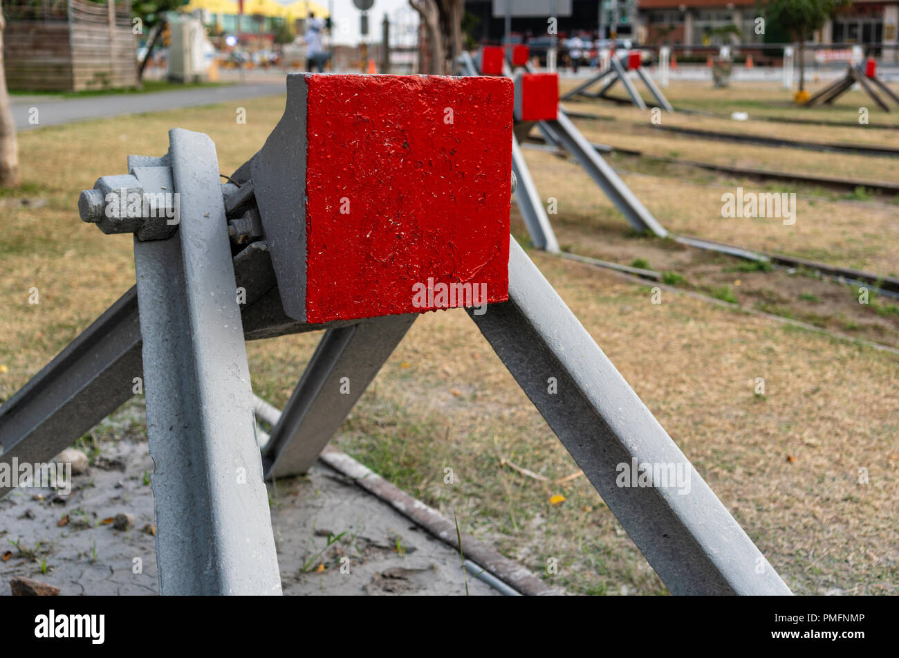 Buffer stop with red painting close up view on old railroad Stock Photo