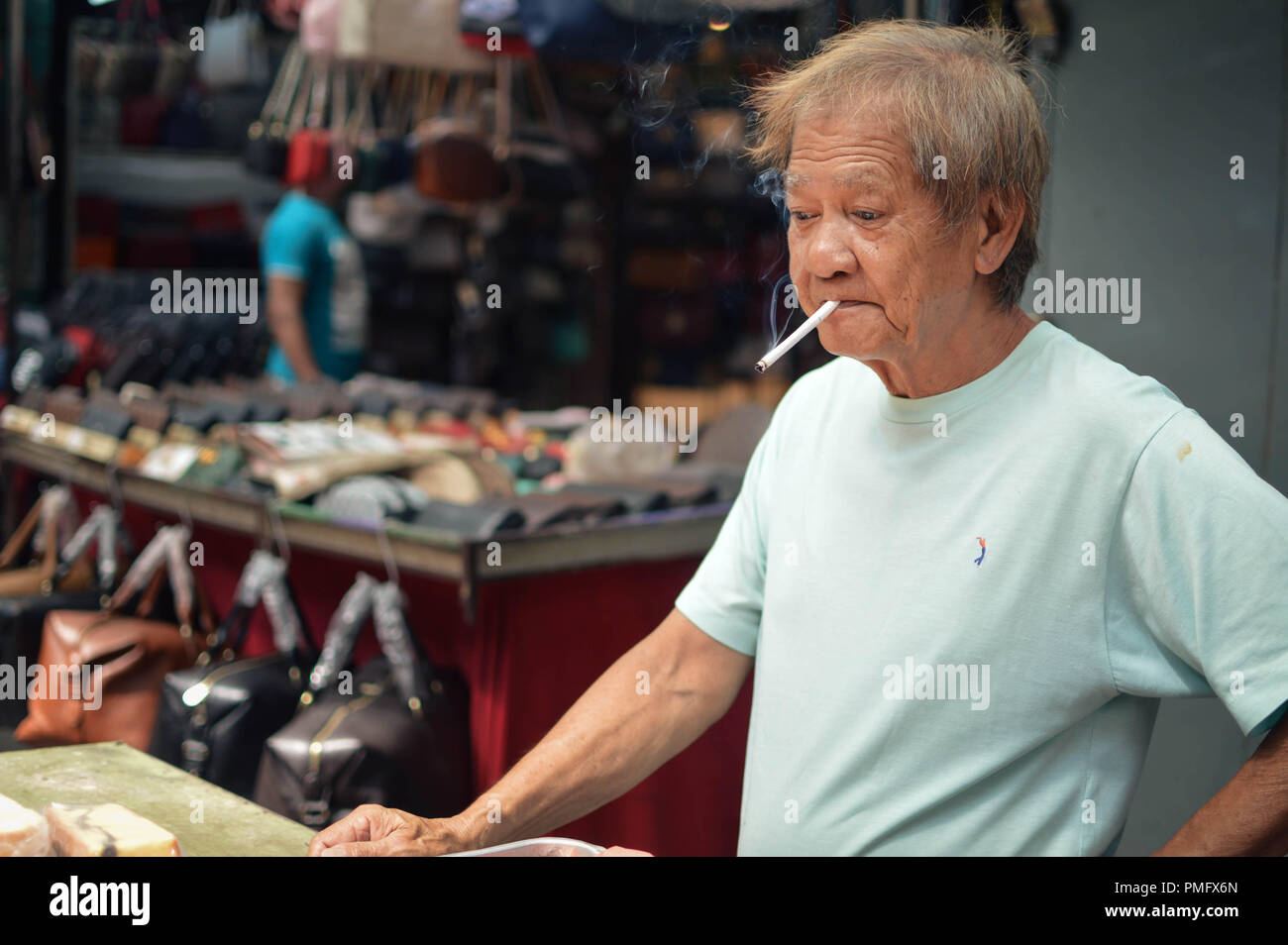 Kuala Lumpur, Malaysia - 10 September, 2017: Chinese street vendor sells food on Jalan Petaling  in Kuala Lumpur, Malaysia Stock Photo