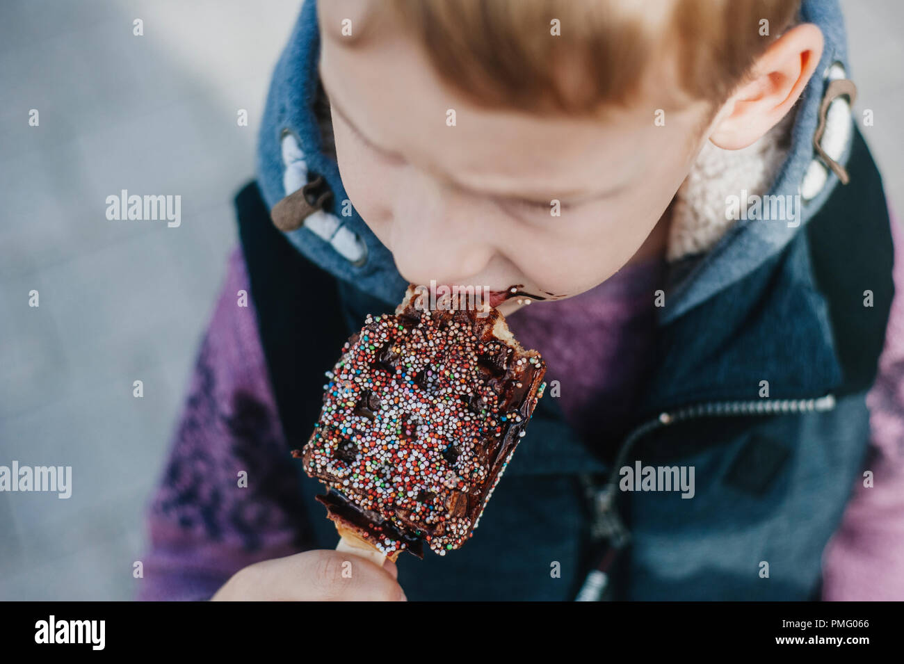 Young boy eating waffles for breakfast. Belgian waffles Stock Photo Alamy