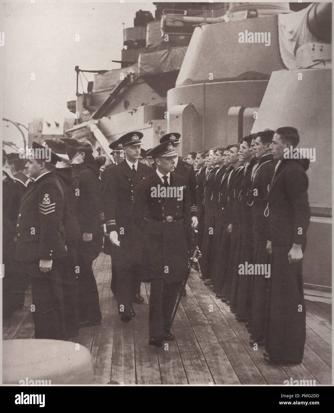 Edward the Eighth in 1936 inspecting crew members on board HMS Royal Oak of the Royal Navy which was later sunk by U-47, 14 October 1939 in Scapa Flow.  Edward VIII later abdicated the throne after seeking to marry Wallis Simpson the divorced American socialite Stock Photo