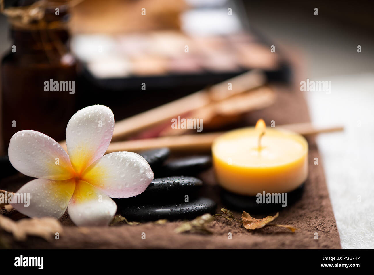 spa setting wirh make up on towel Stock Photo