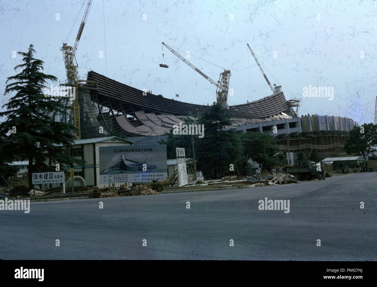 Rare color image of the construction of Yoyogi National Stadium, Shibuya, Tokyo, by the Shimizu Corporation, then considered an unprecedented architectural achievement, and site of Japan's 1964 Olympic Games, 1963. () Stock Photo