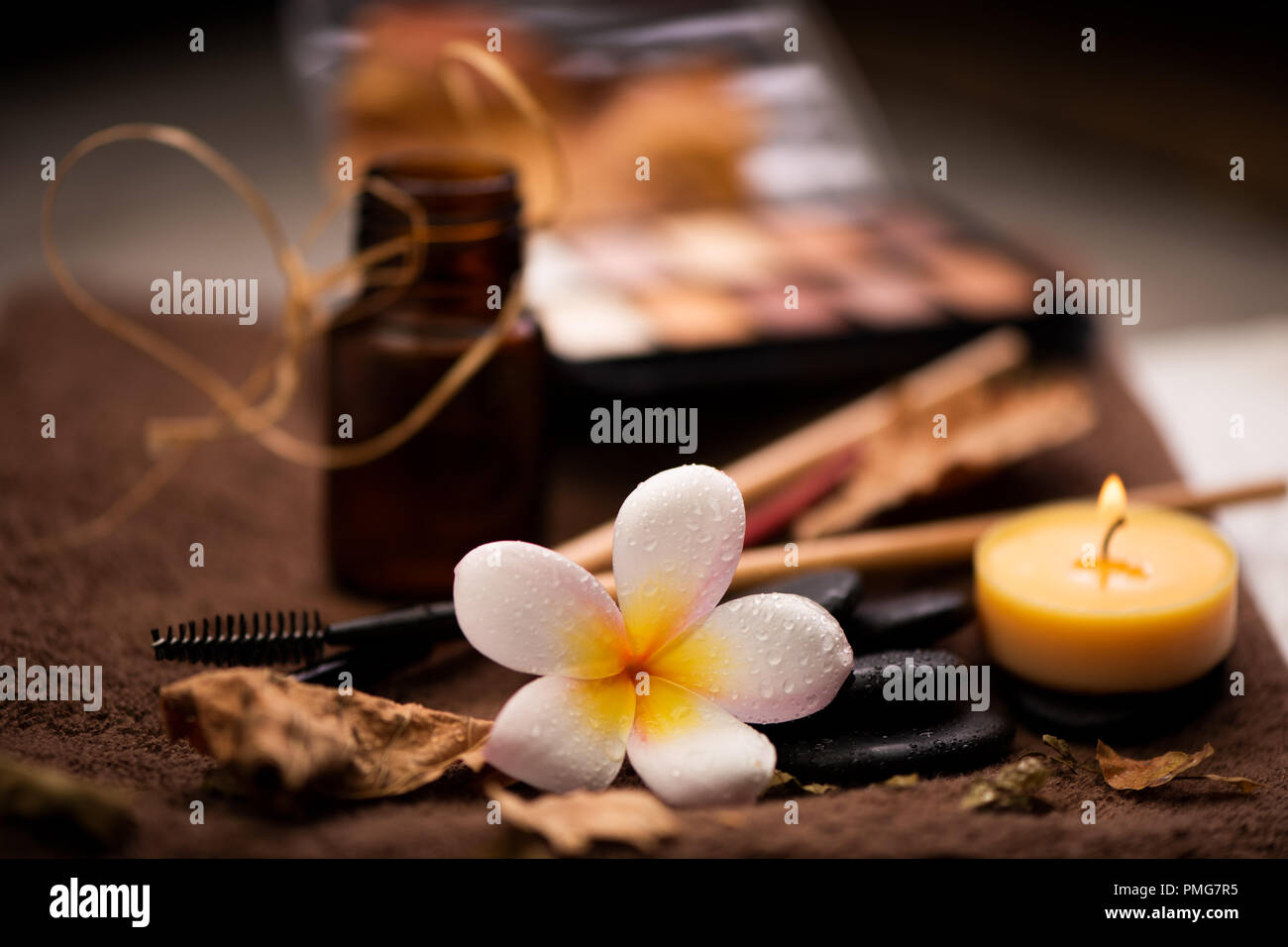 spa setting wirh make up on towel Stock Photo