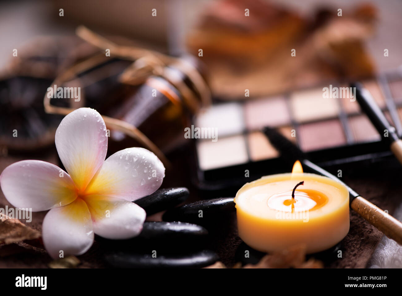 spa setting wirh make up on towel Stock Photo