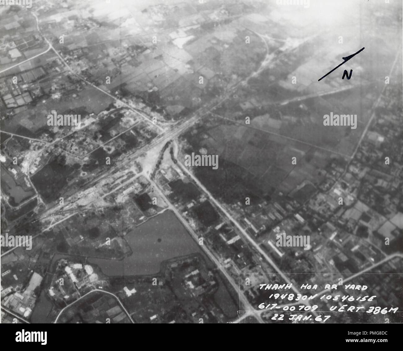 Black and white aerial photograph showing a railroad and rail yard in Thang Hoa, a populated region of northern Vietnam, photographed during the Vietnam War, January 22, 1967. () Stock Photo