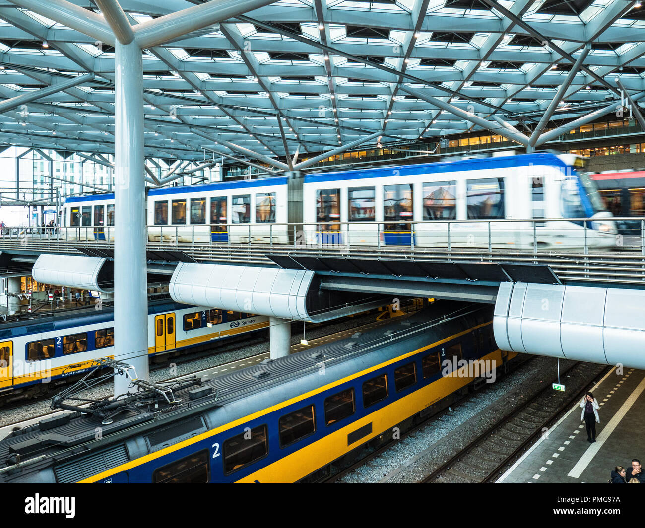 The Hague Railway Station - multi level transport at Den Haag railway station, trams above, trains below Stock Photo