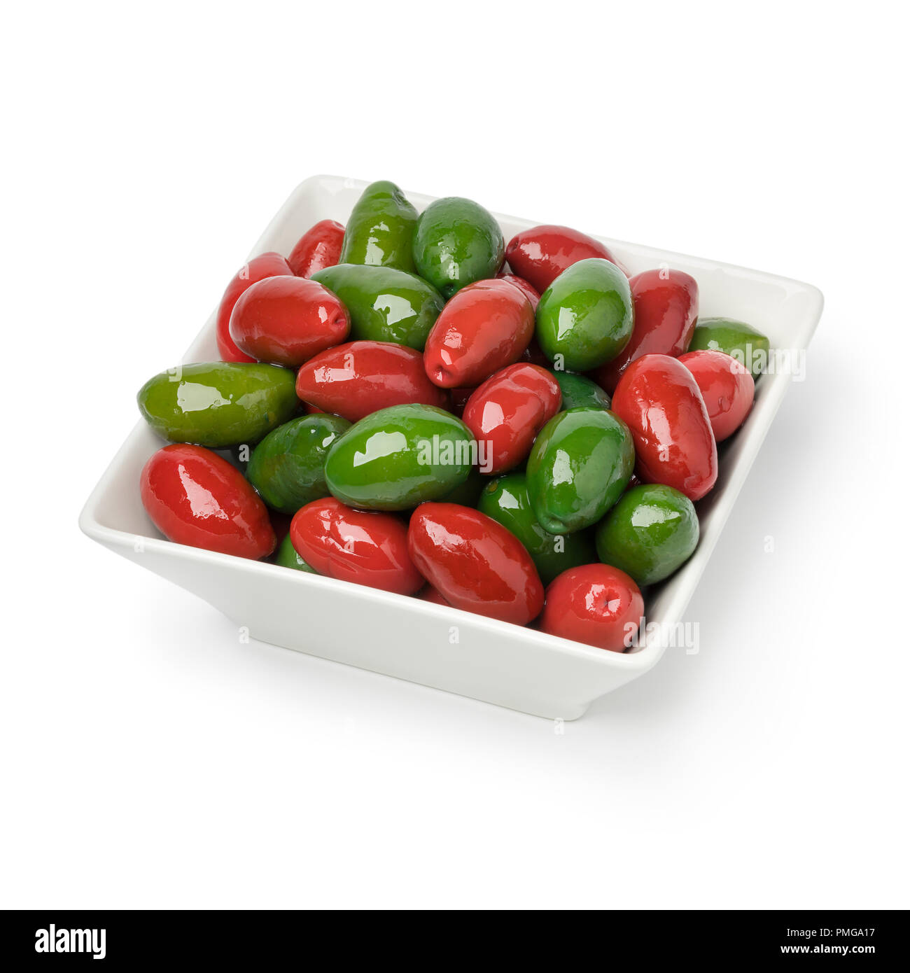 Bowl with red and green Italian Bella olives isolated on white background Stock Photo