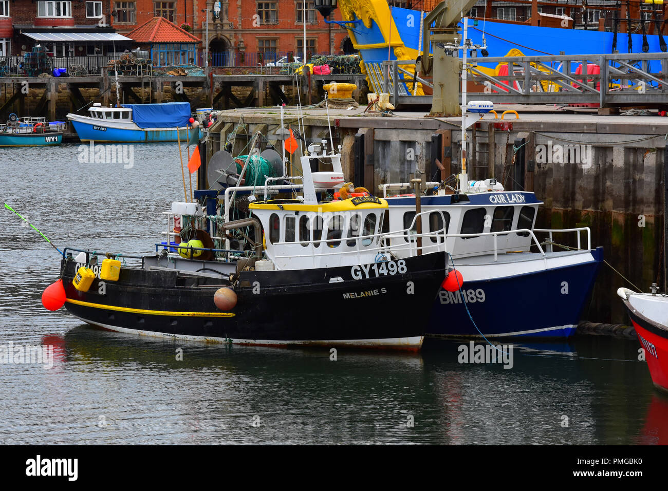 Boats in the harbour at Whitby, North Yorkshire Moors, England UK Stock ...