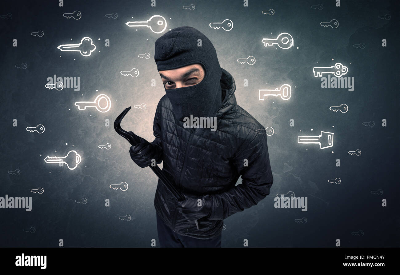 Burglar standing with tools in his hand. Stock Photo