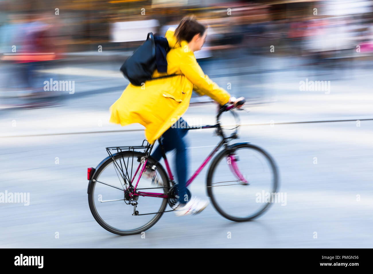 bicycle rider in the city in camera made motion blur Stock Photo - Alamy