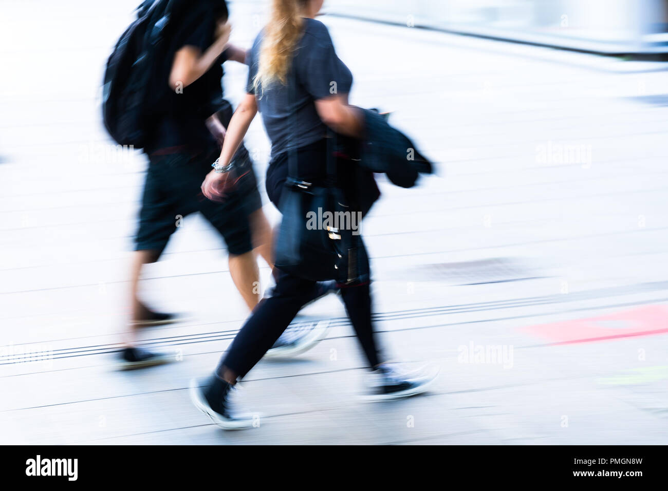 picture with camera made motion blur of people walking in the city ...