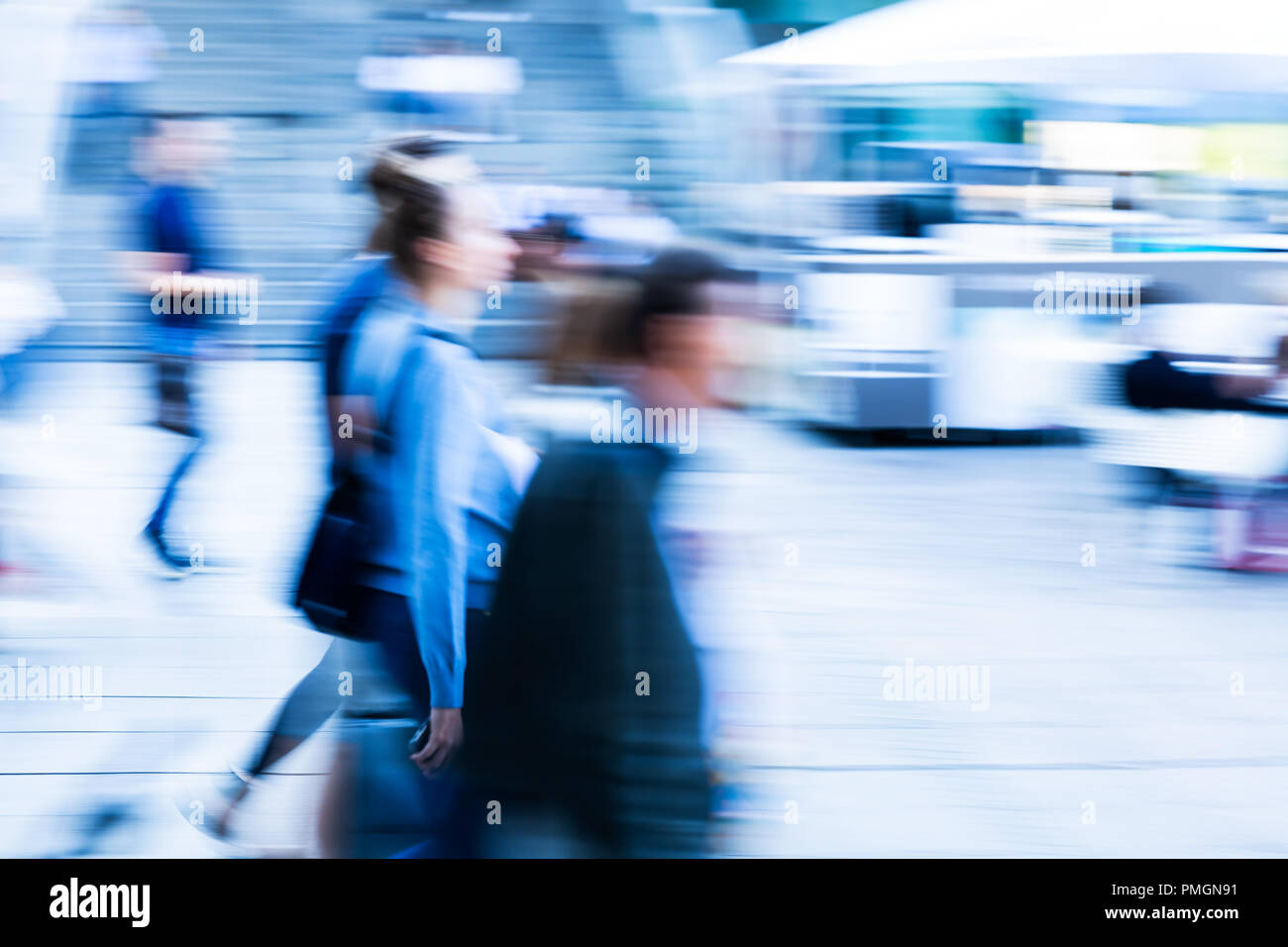 picture with camera made motion blur of people walking in the city ...