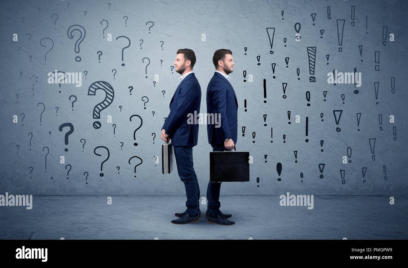 Young conflicted businessman choosing between two directions with ...