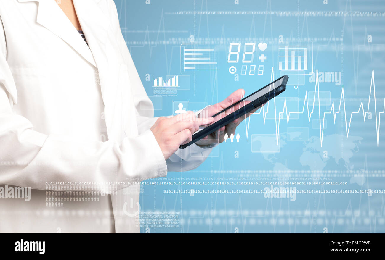 Female doctor holding tablet with blue background and heart related ...