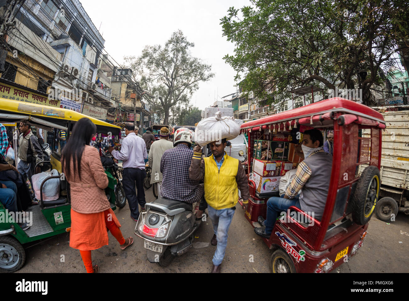 Delhi, India - December 11, 2017: crowd and traffic on street at Chandni Chowk, Old Delhi, famous travel destination in India. Chaotic city life, work Stock Photo