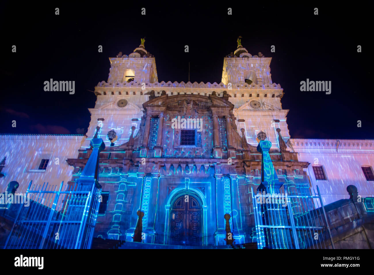QUITO, ECUADOR- AUGUST, 15, 2018: Crowd admiring the spectacle of lights projected on the facade of San francisco church, festival of light is an event that takes place every August in Quito Stock Photo