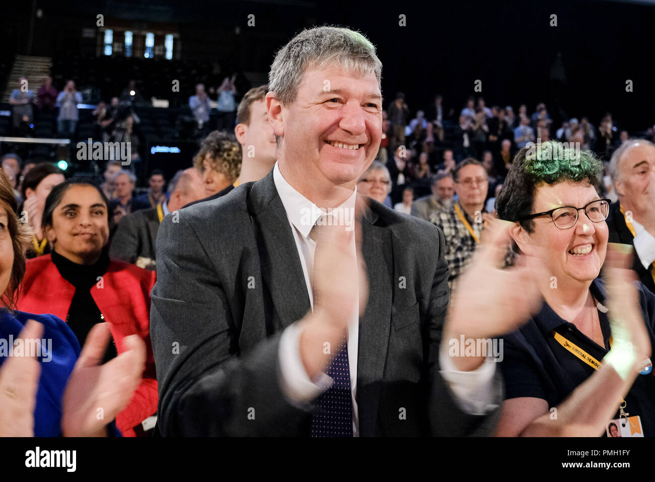 Brighton, UK. 18th September 2018. Willie Rennie is applauded following his speech to the Liberal Democrat Autumn Conference  on Tuesday 18 September 2018 held at Brighton Centre, Sussex. Pictured:  Alistair Carmichael, Commons Chief Whip, Liberal Democrat Spokesperson for Northern Ireland , MP for Orkney and Shetland, and , Menzies Campbell, Liberal Democrat Spokesperson on Defence, congratulate Willie following his speech. Picture by Julie Edwards. Credit: Julie Edwards/Alamy Live News Stock Photo