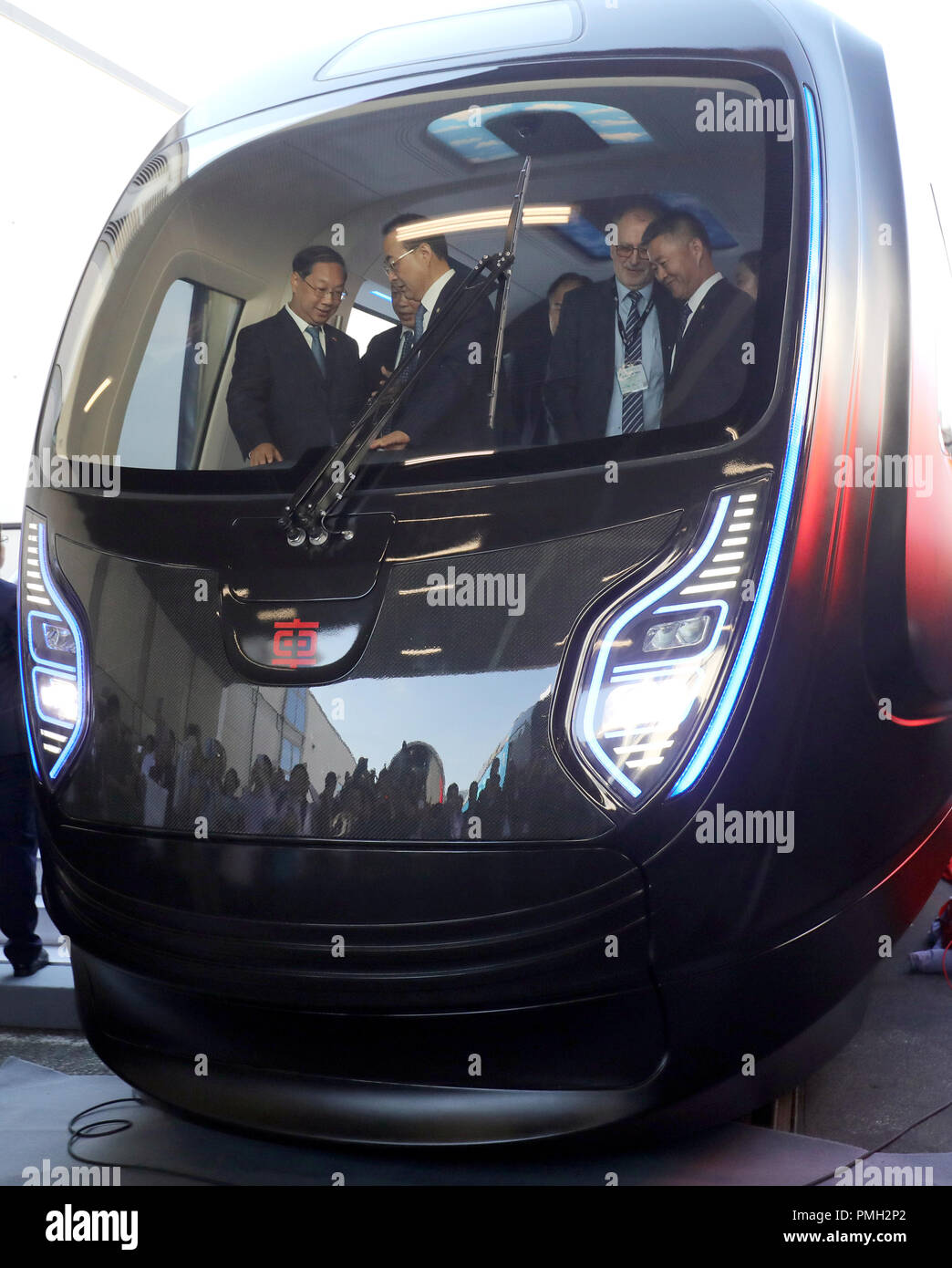 18 September 2018, Berlin: People are standing on the railway fair Innotrans in a Chinese subway train of the company CRRC in lightweight construction. The train will be presented in a world premiere on the exhibition grounds between the halls under the radio tower. A Saxon company was involved in the development of the train. Photo: Wolfgang Kumm/dpa Stock Photo