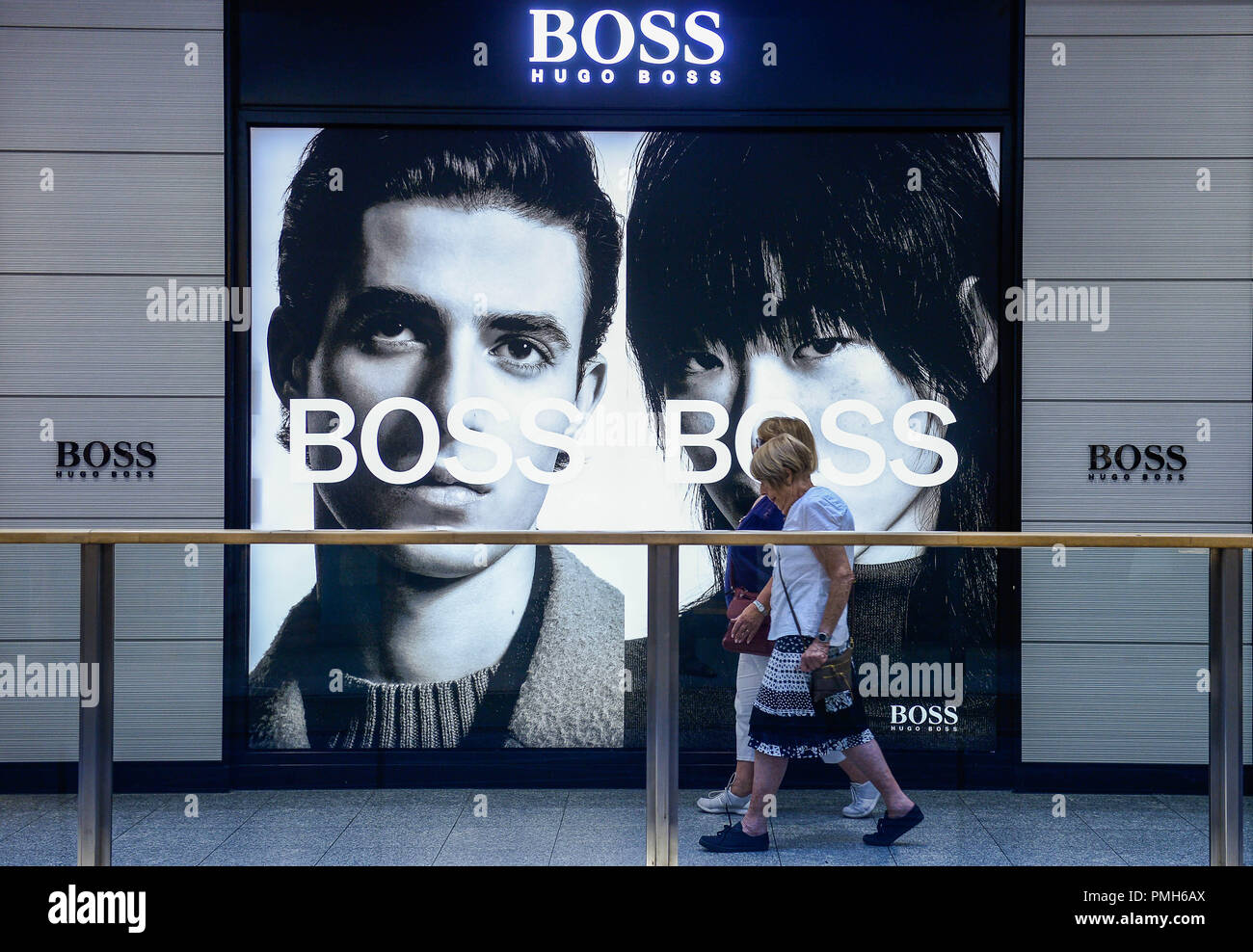 September 18, 2018 - Krakow, Poland - Women seen walking by a HUGO BOSS  advertisement. (Credit Image: © Omar Marques/SOPA Images via ZUMA Wire  Stock Photo - Alamy