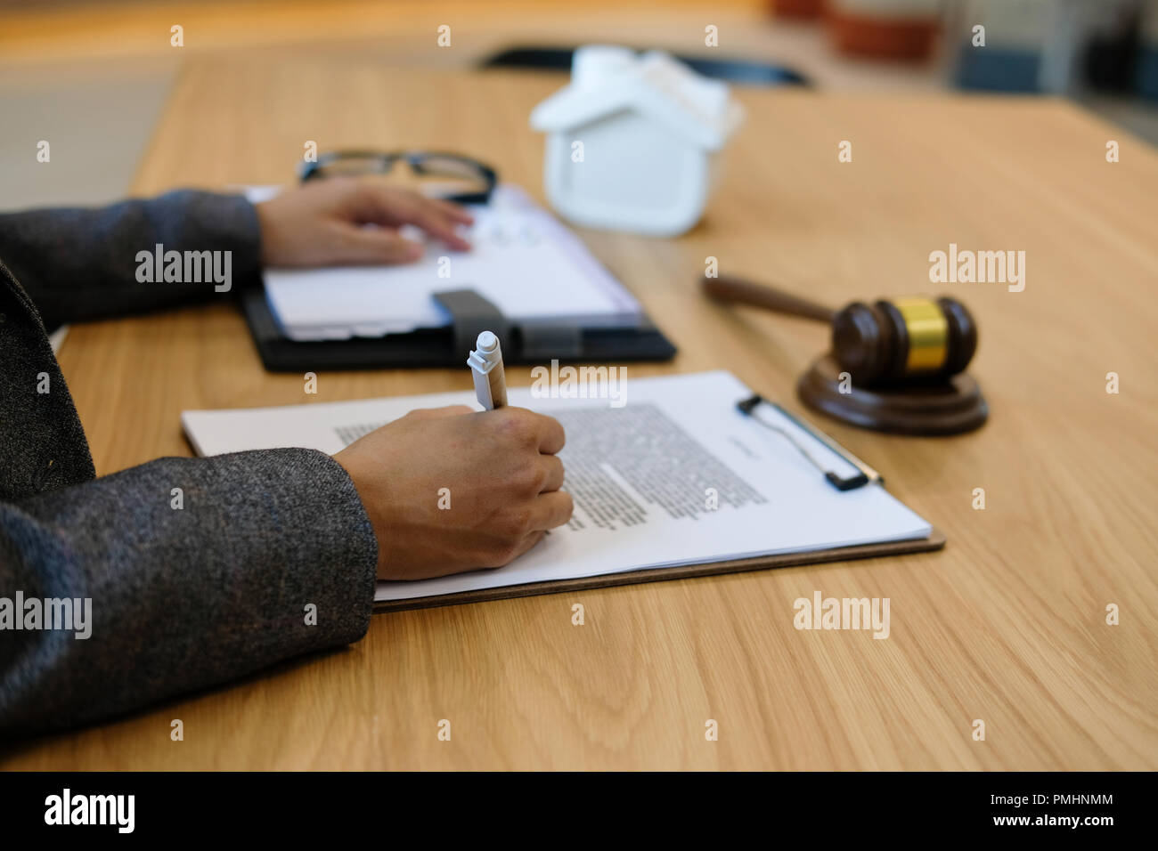 lawyer read contract. woman reviewing mortgage loan document with judge