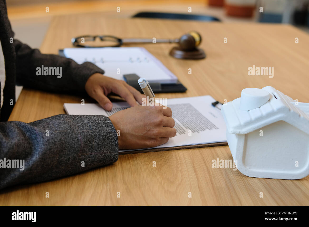 lawyer read contract. woman reviewing mortgage loan document withhouse
