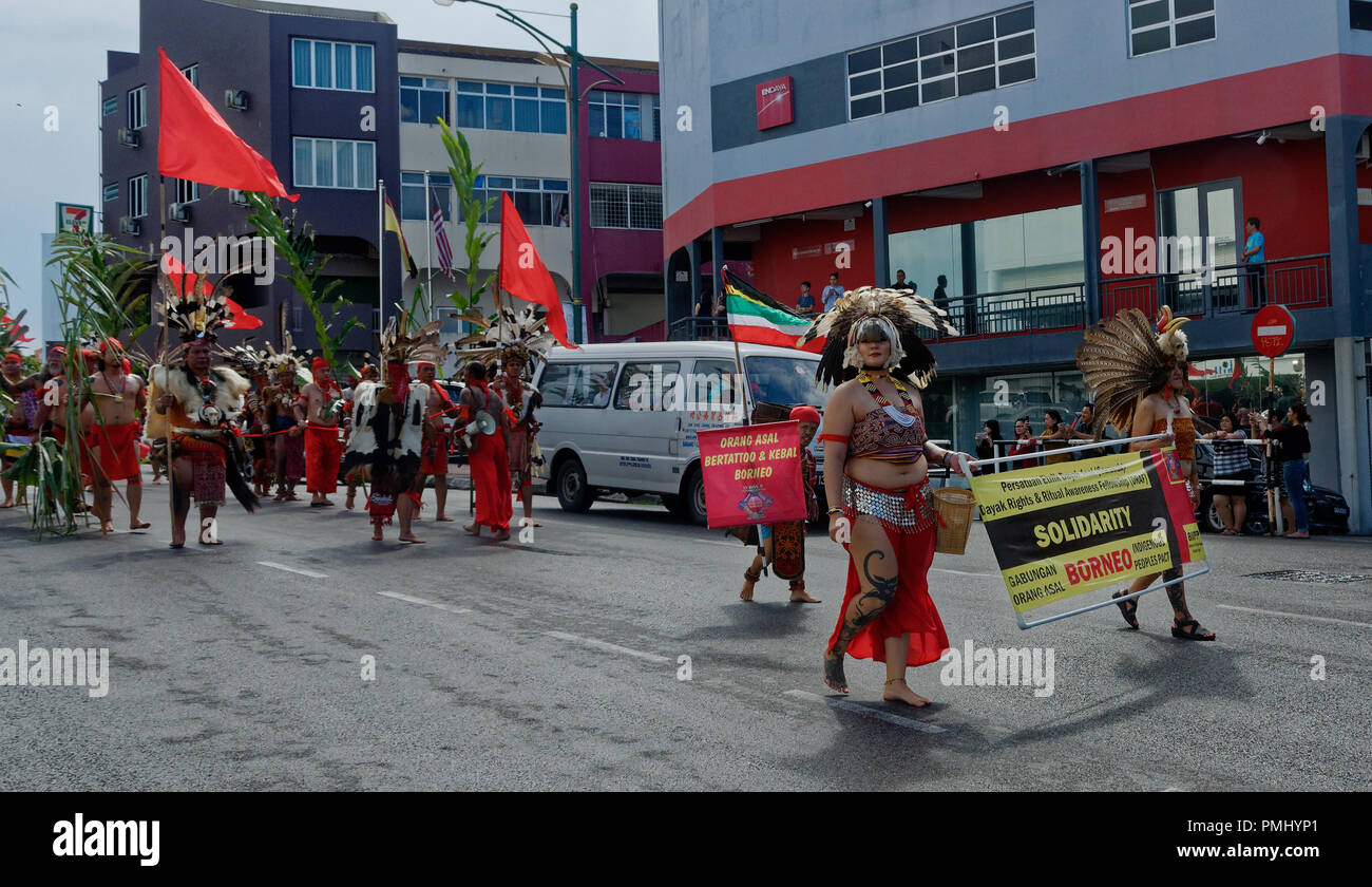 Iban warriors at the Gawai parade with traditional headdress, feathers and costume, Kuching, Sarawak, Malaysia, Borneo Stock Photo