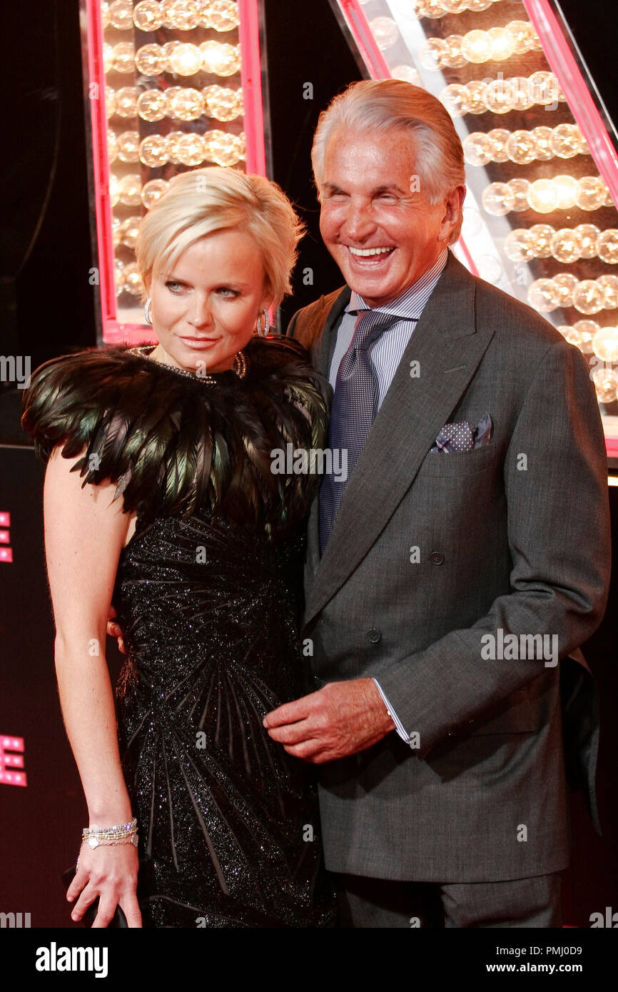 George Hamilton and Barbara Sturm at the Premiere of Screen Gems' 'Burlesque'. Arrivals held at Grauman's Chinese Theater in Hollywood, CA, November 15, 2010. Photo by Joseph Martinez / PictureLux File Reference # 30704 240PLX   For Editorial Use Only -  All Rights Reserved Stock Photo
