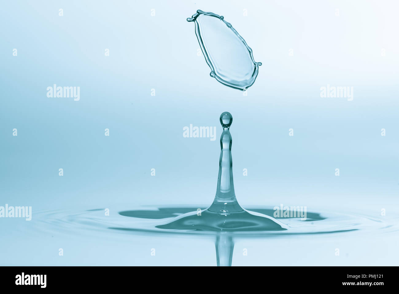 Collision of falling water droplets Stock Photo