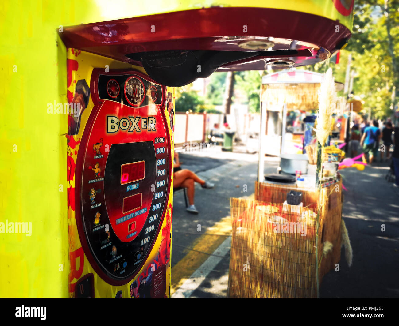 punch boxing speed bag arcade punch ball machine street fair luna park Stock Photo