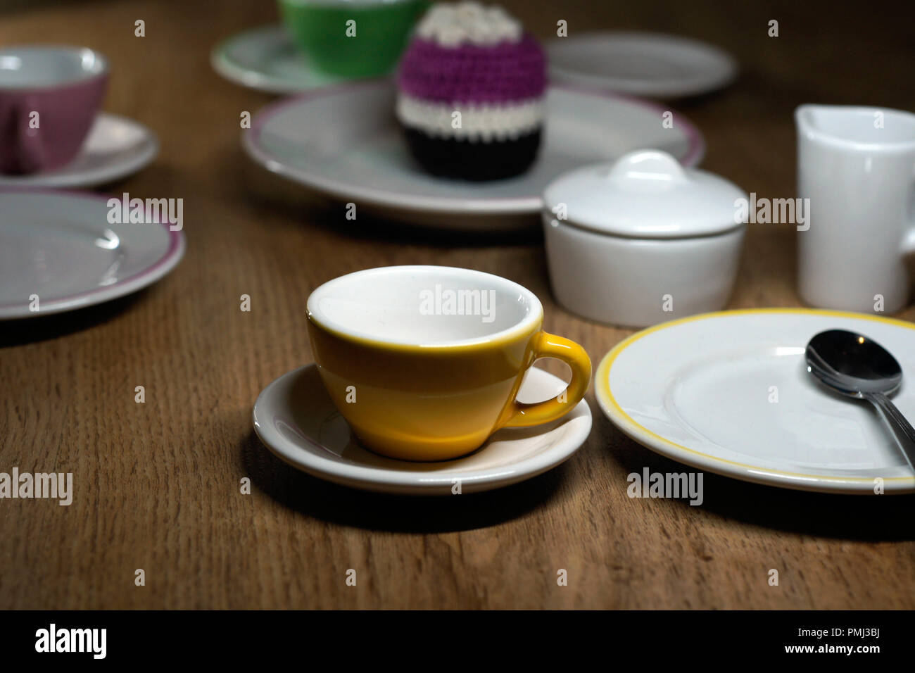 brown yellow cup and other crockery Stock Photo